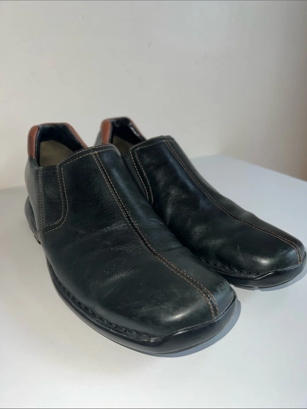 Cole Haan Black Leather Slip-On Loafers with Brown Heel Detail